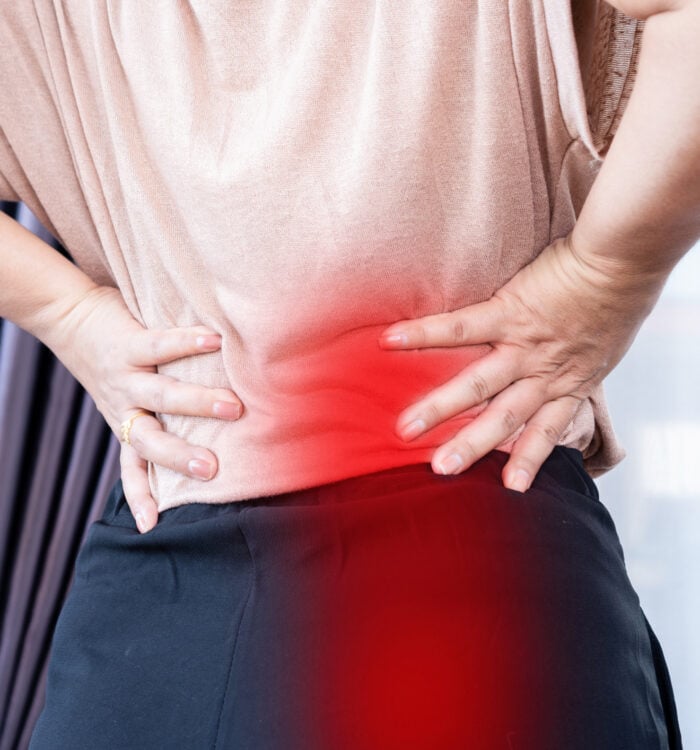 closeup woman suffering from buttocks and lower back pain, Sciatica Pain concept